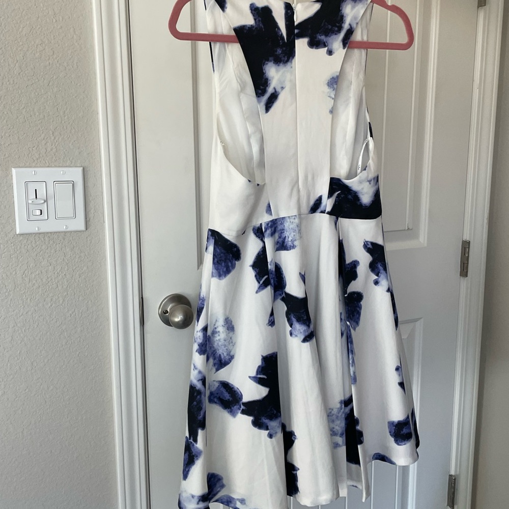 White dress with blue floral pattern. Size medium. Lulu’s. Worn once